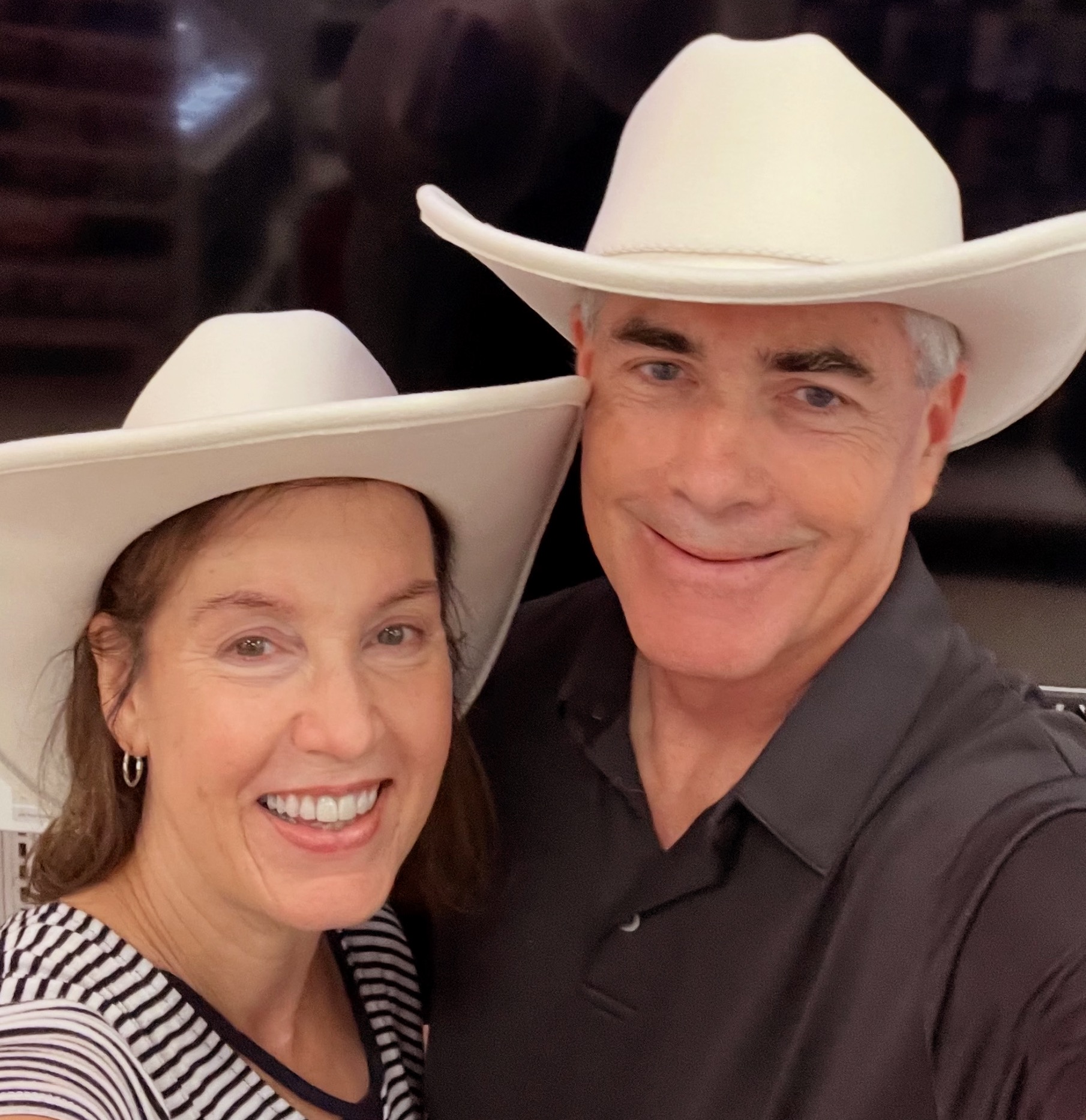 Pastor and Margaret wearing comboy hats