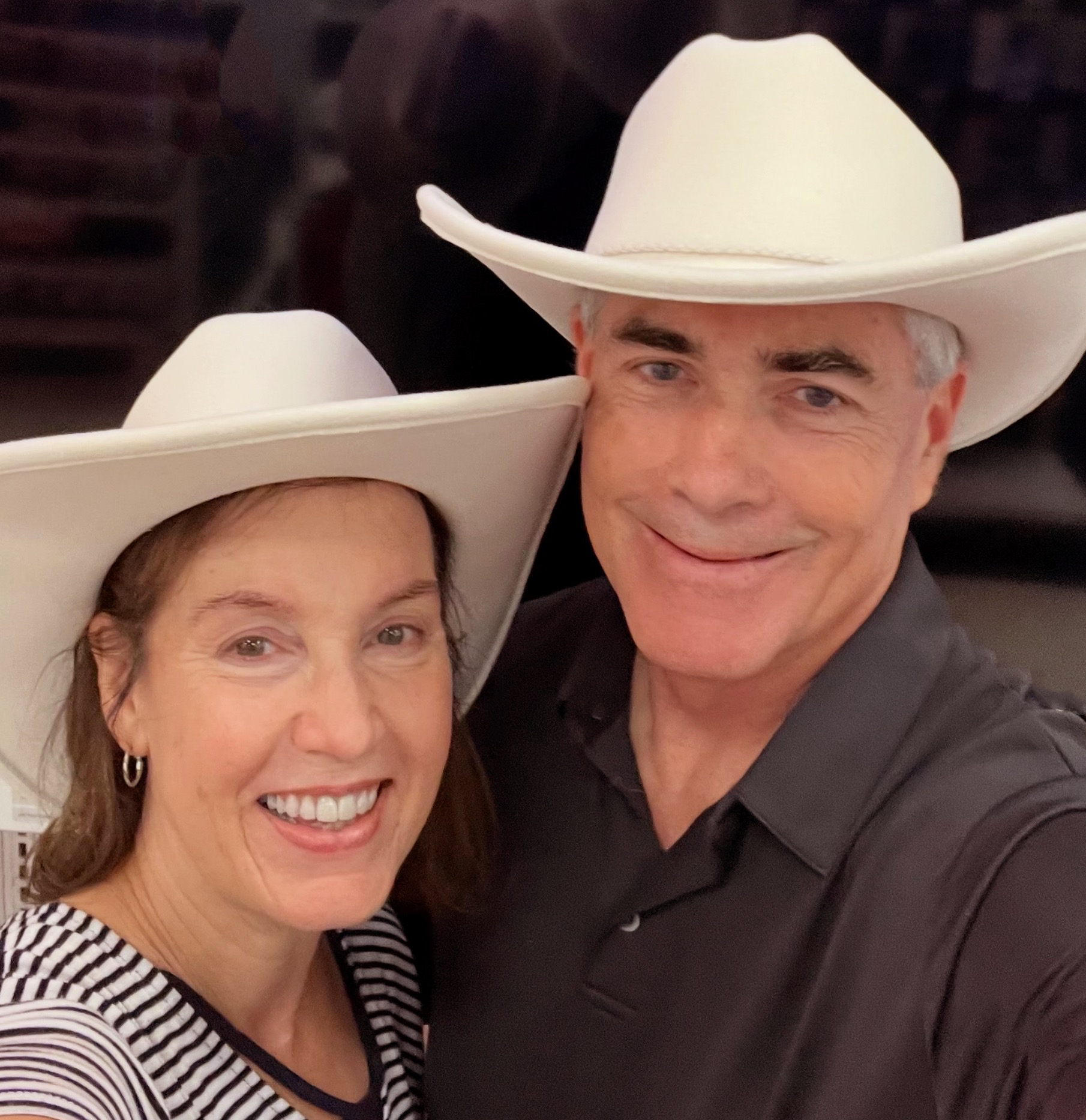 Pastor and Margaret wearing comboy hats